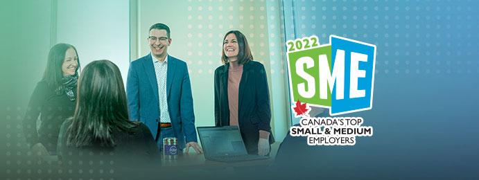 Humania employees with SME 2022 logo